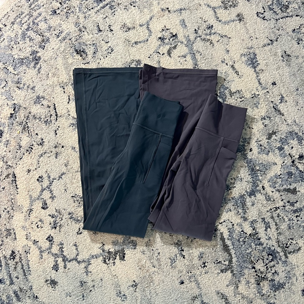 Two pairs AthletaSalutation Stash High Rise Flare Pant